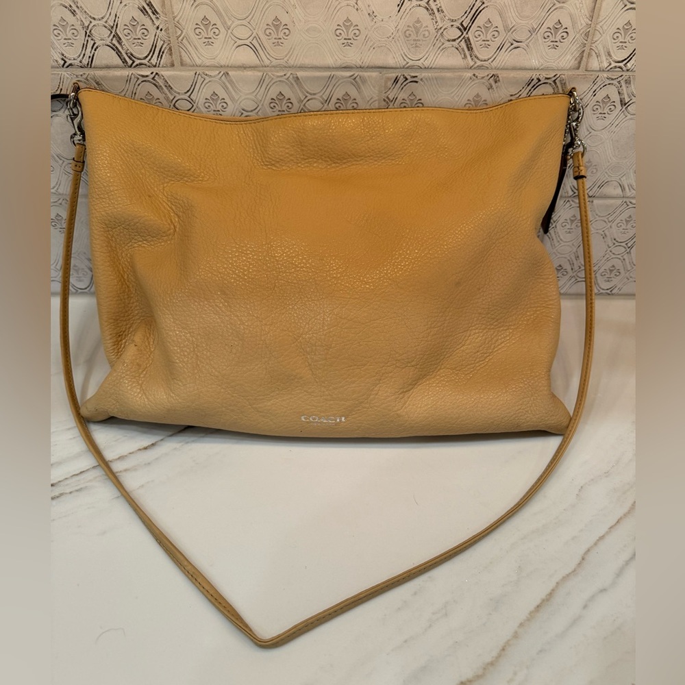 Beautiful Coach cream colored leather laptop bag or purse